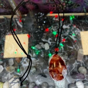 Beautiful Clear Quartz With Red And Pink Pendant On Brown/Black Cord